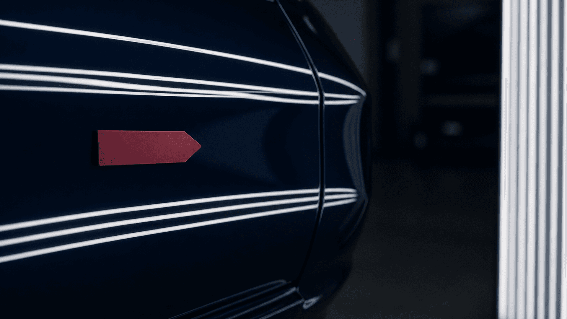 Illustrative image of crisp reflected light across a smooth automotive finish