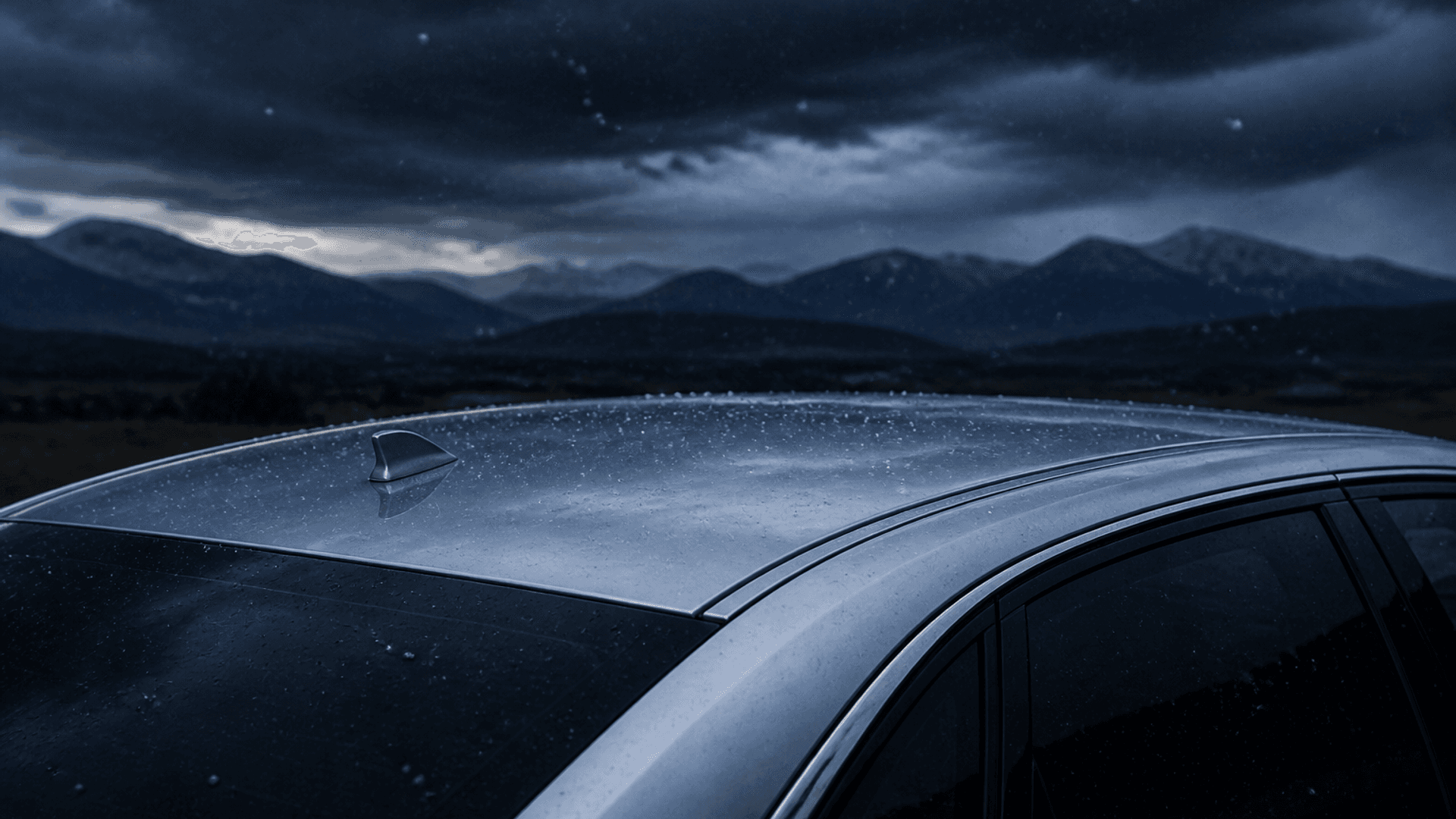 Illustrative image: hail falling from a Front Range storm sky over a vehicle roofline